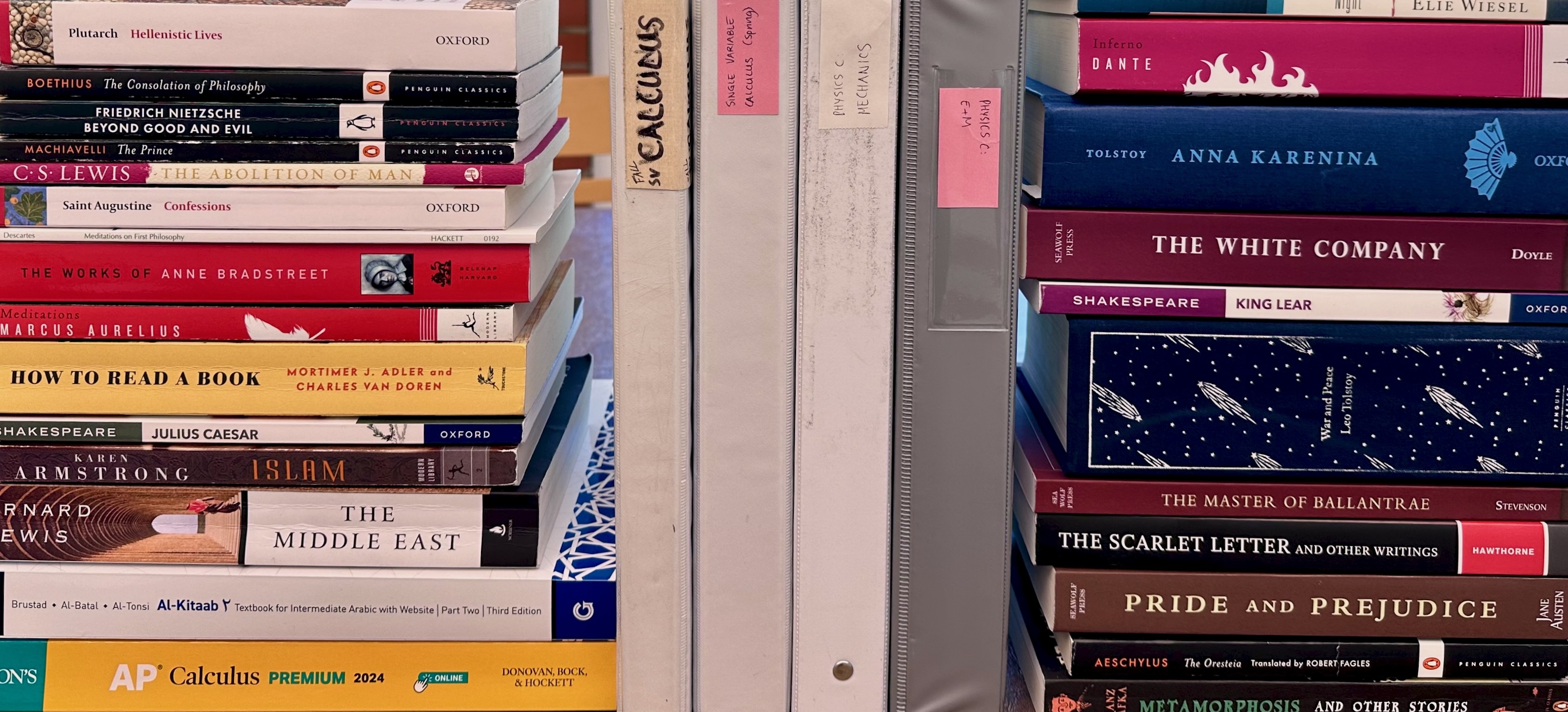 Homeschool books stacked on a table